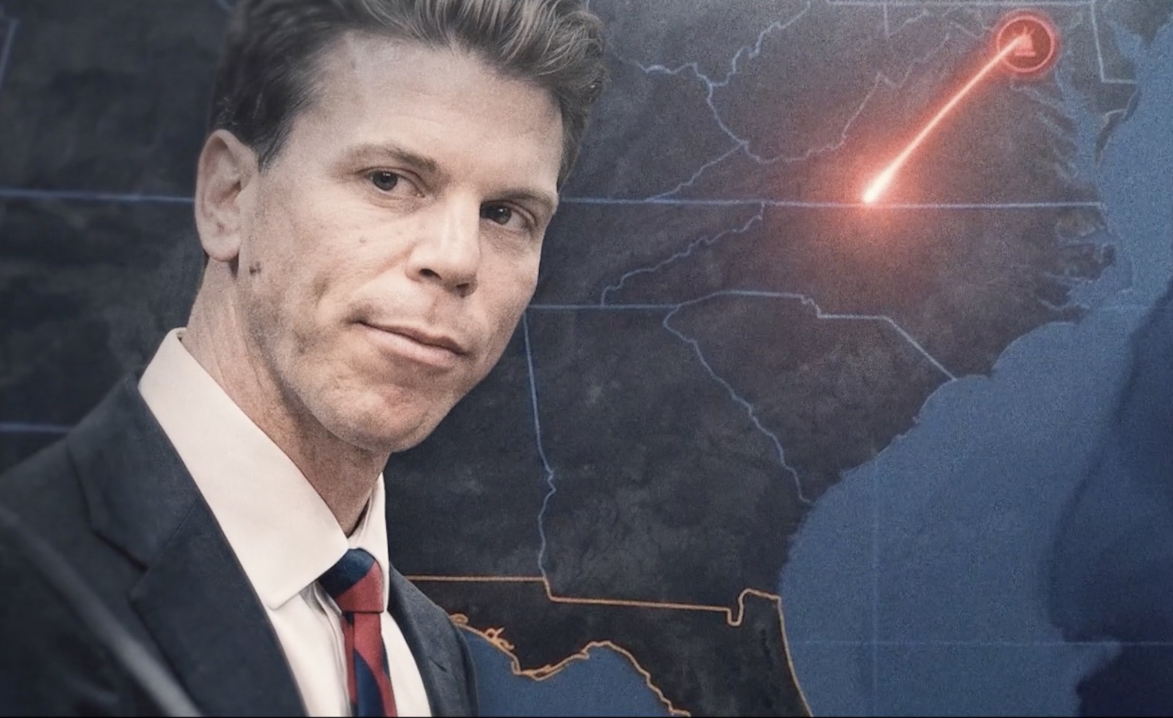 Austin Rogers beside a route map from Virginia toward Florida
